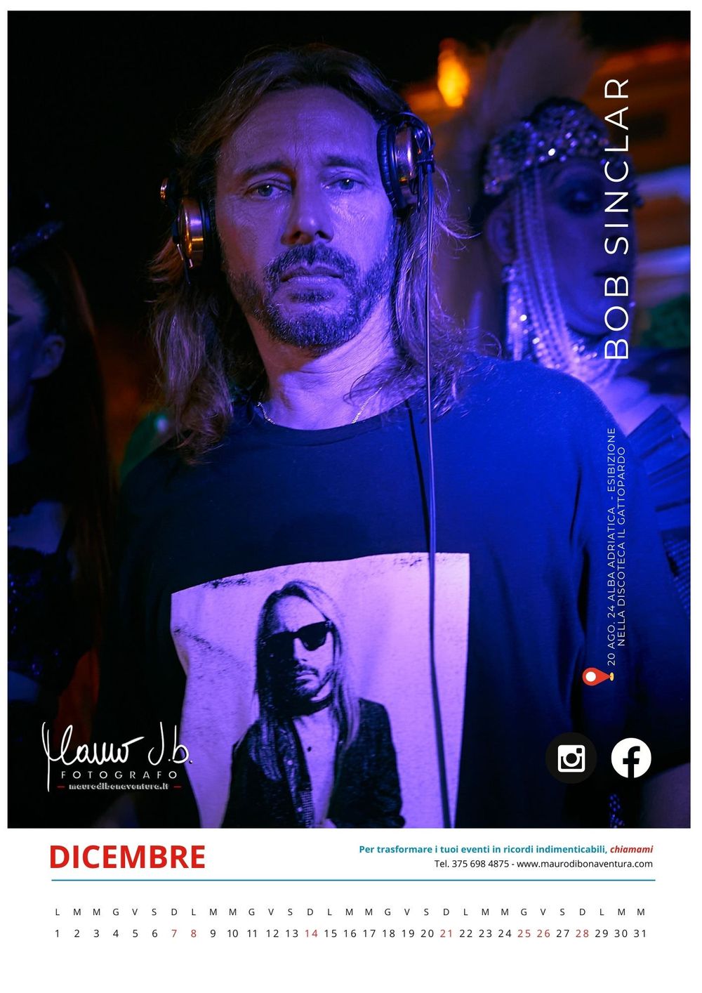 DJ wearing headphones and graphic t-shirt performing under blue lighting at night.