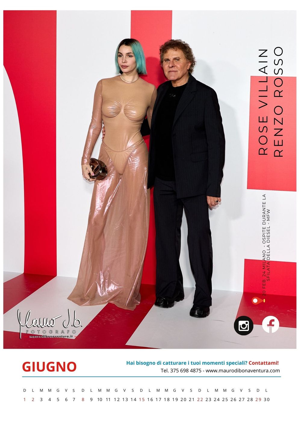 Two people posing against red and white backdrop at formal fashion event.