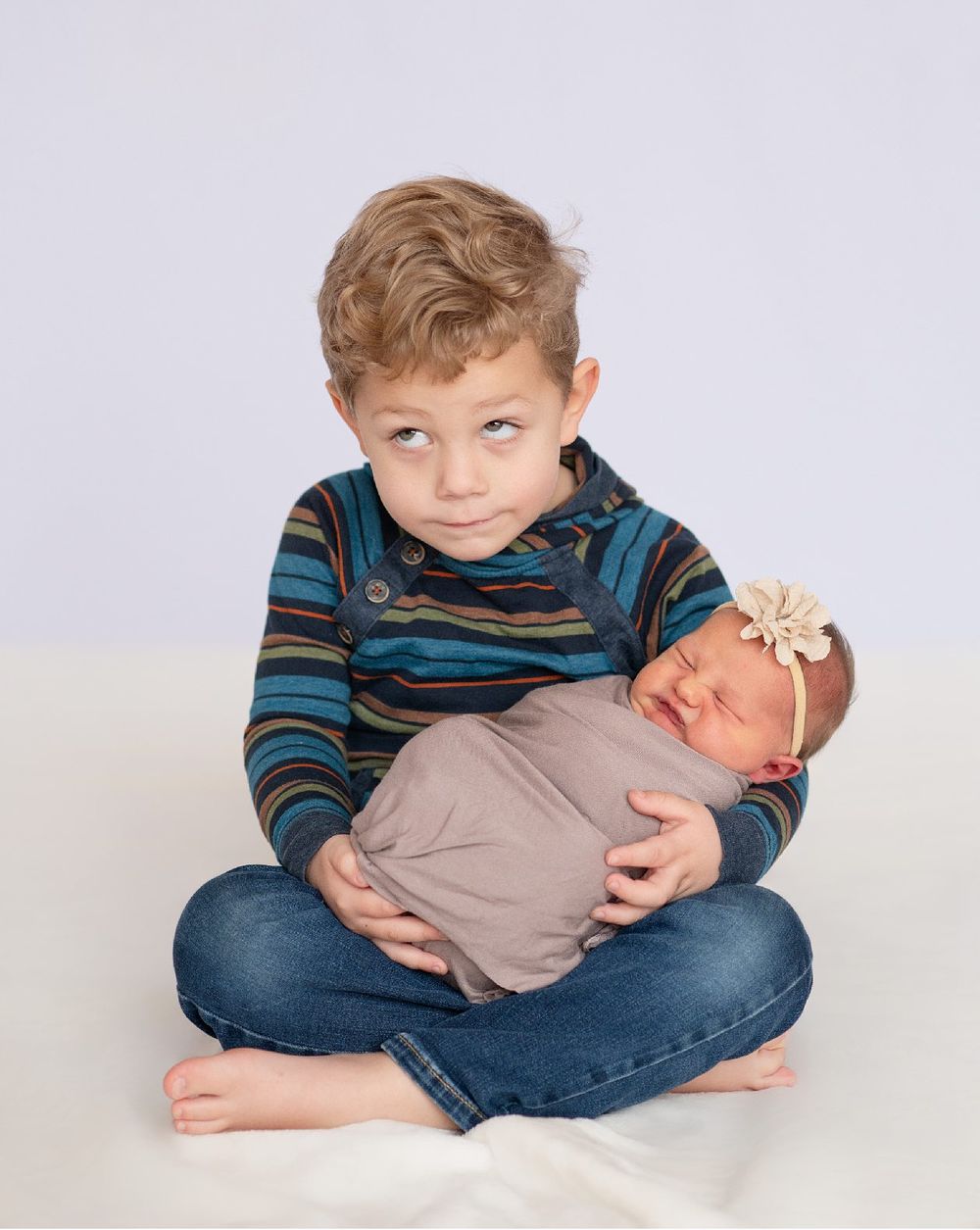 Newborn girl with family in natural light studio by Bartlesville Newborn Photographer Kristi Bray Photography