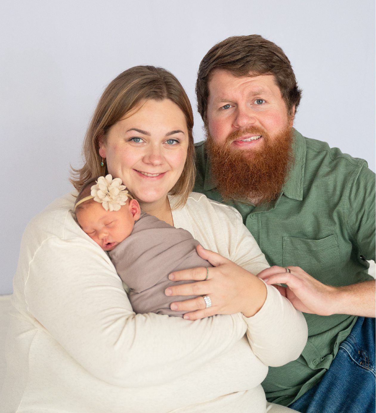 Newborn girl with family in natural light studio by Bartlesville Newborn Photographer Kristi Bray Photography