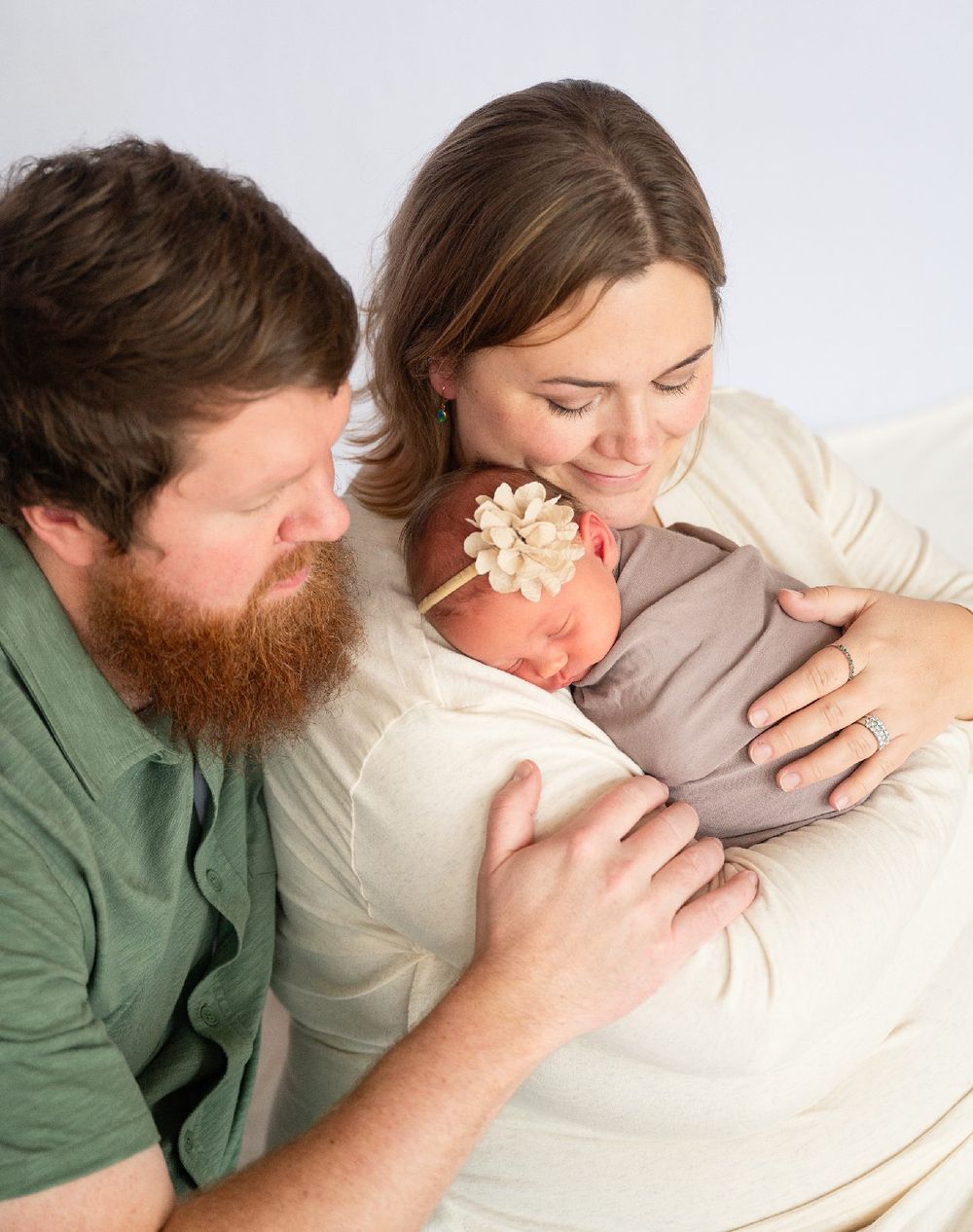 Newborn girl with family in natural light studio by Bartlesville Newborn Photographer Kristi Bray Photography