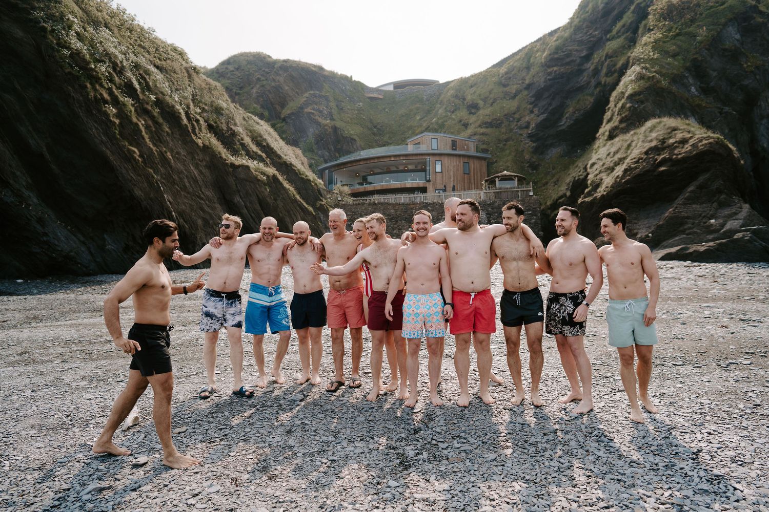 Groomsmen on morning of the wedding at tunnels beach wedding venue in north Devon, preparing for a morning swim
