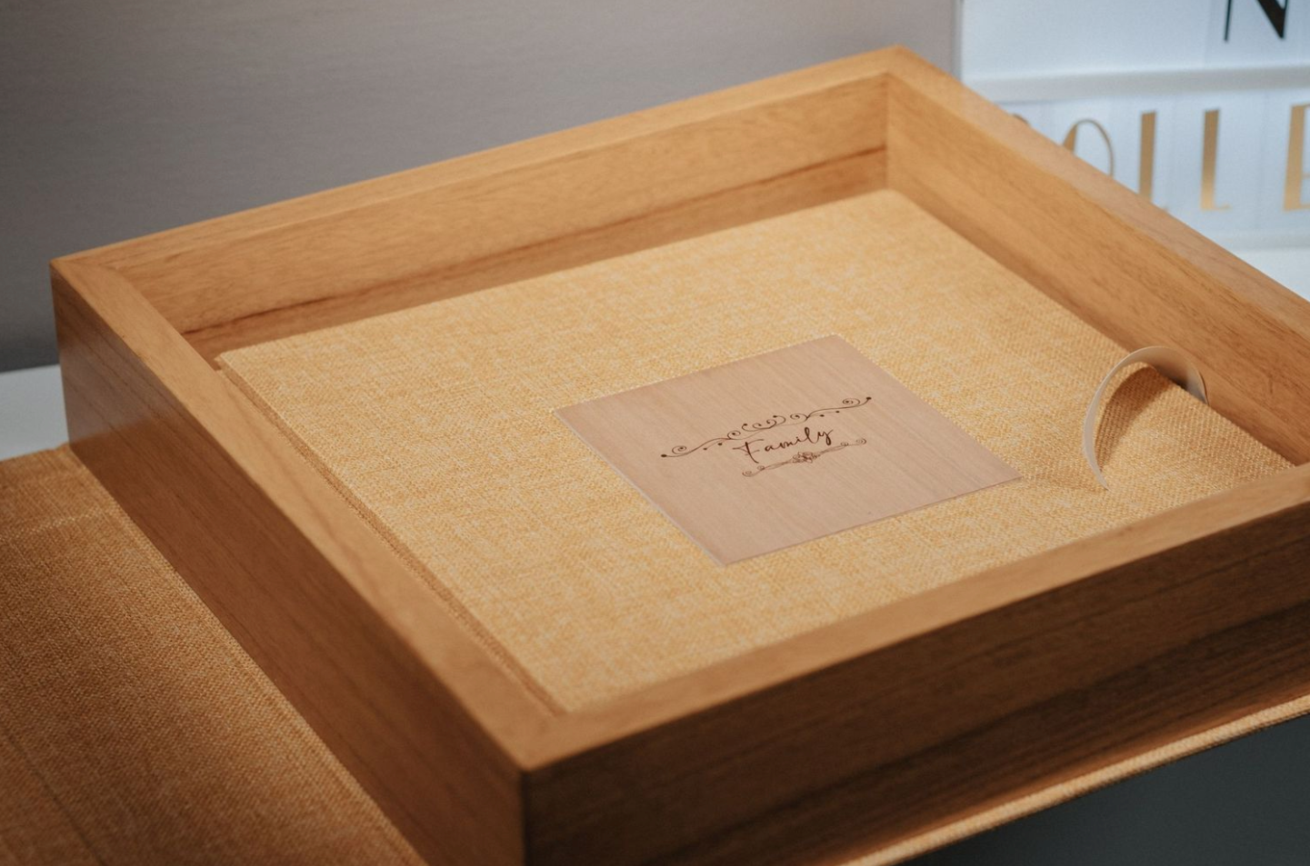 Wooden presentation box with custom branding shown from above.