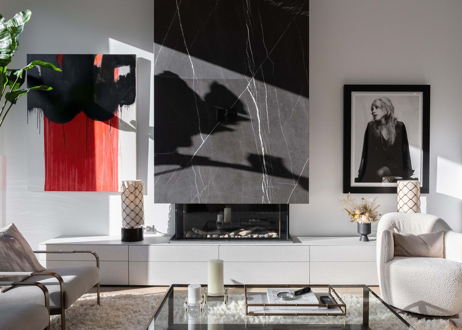 Contemporary living room with monochromatic color scheme featuring modern decor and natural light inside 98 Crawford St, Toronto.