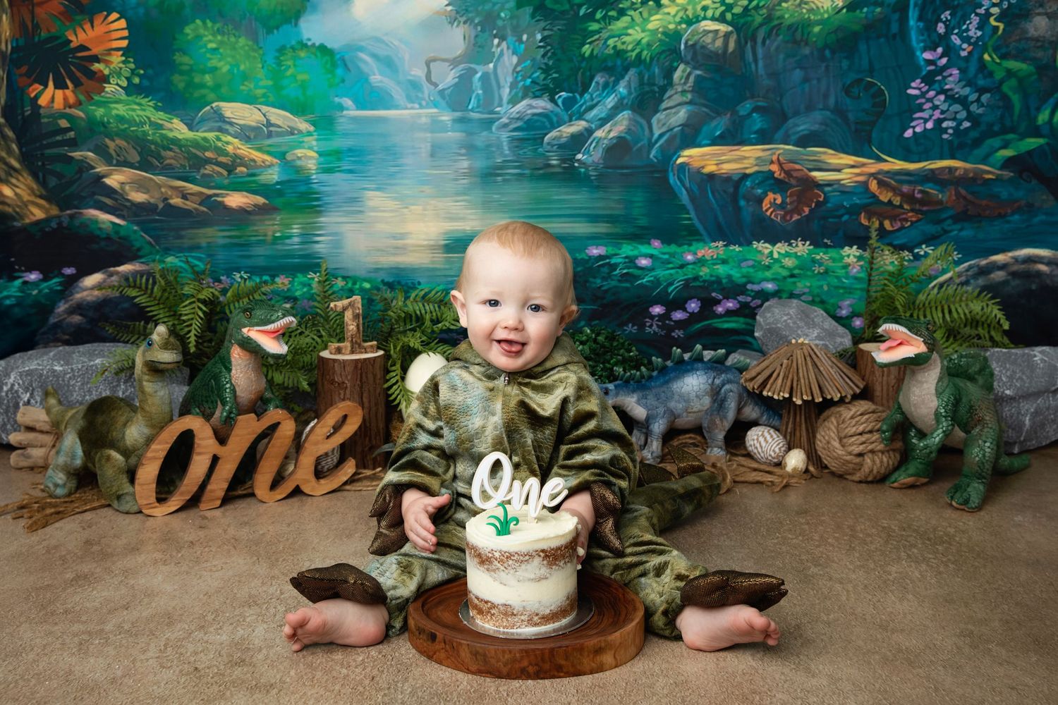 Baby enjoys a Toy Story themed first birthday cake smash surrounded by colorful balloons and beloved character toys.