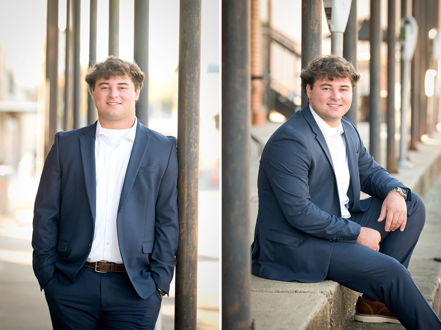 Young man in navy blazer and white shirt posing outdoors for senior portraits in an urban setting.