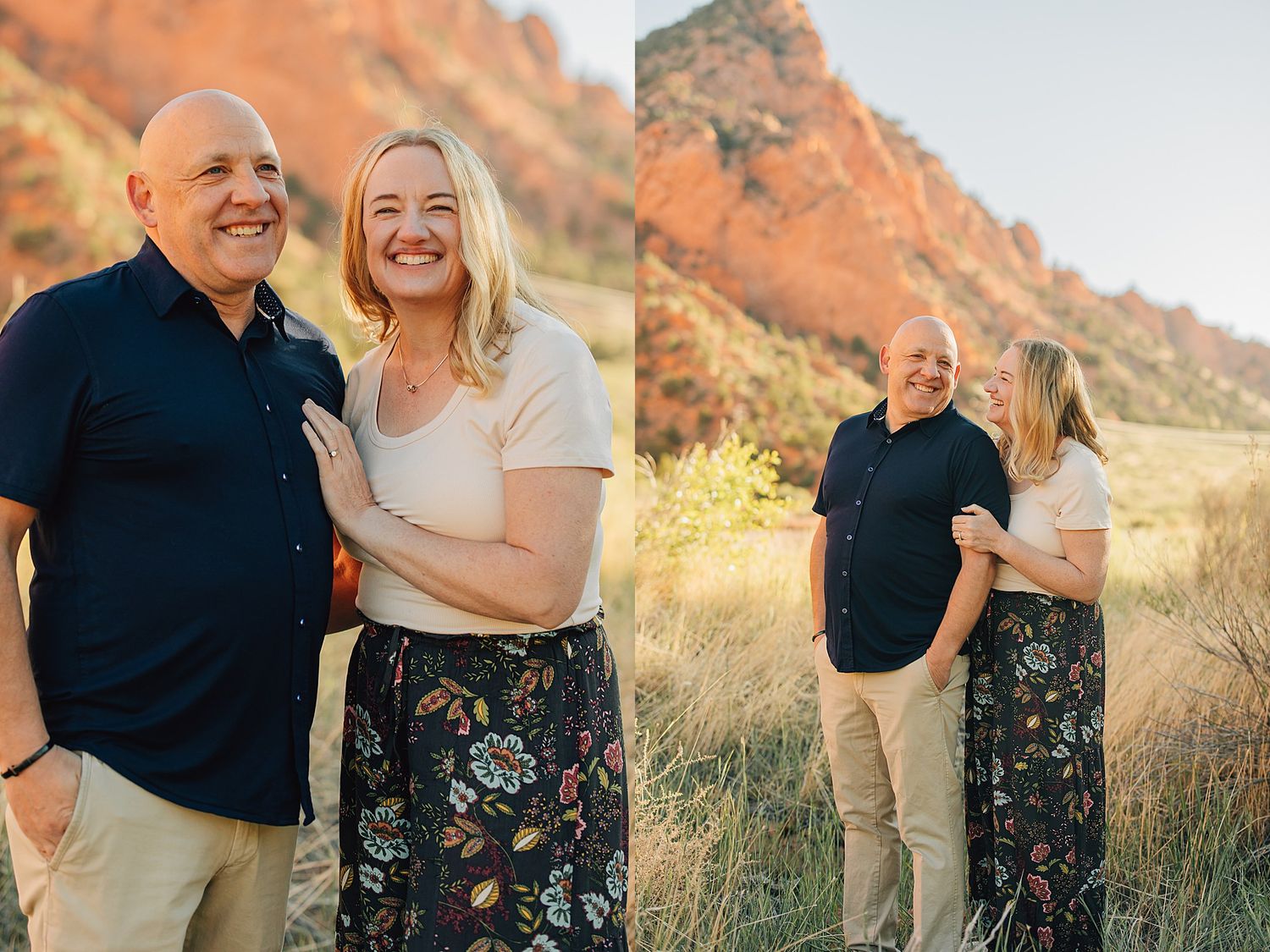 Couple smiling together in golden hour light with red rock formations and tall grass in a scenic outdoor setting.