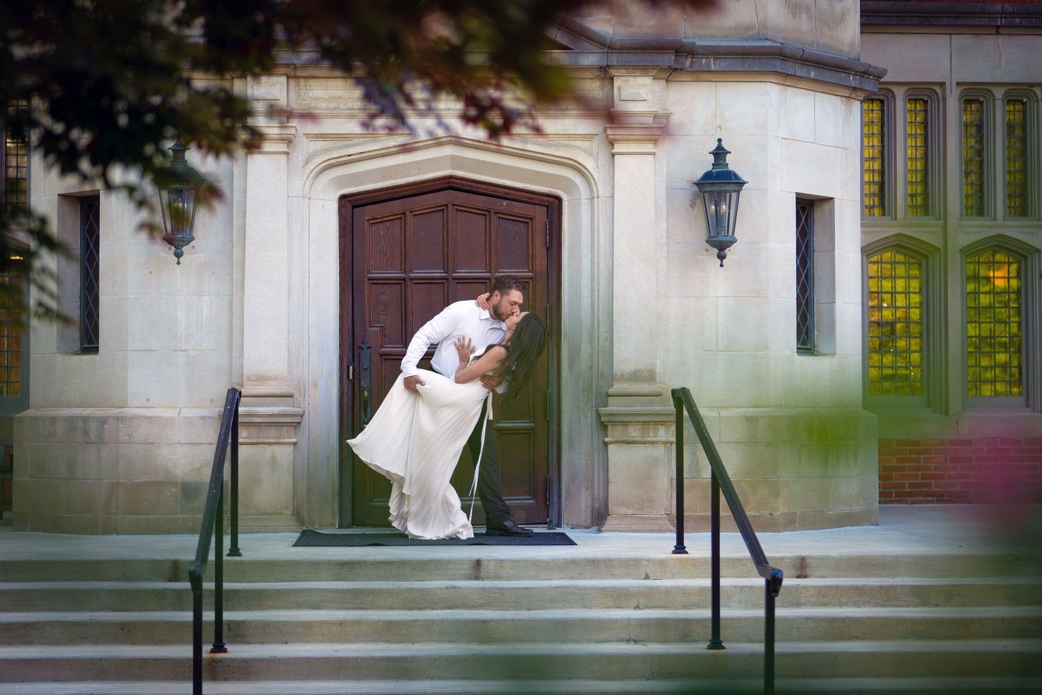 engaged couple share a romantic dip kiss at Jeffrey Mansion for their Engagement Session