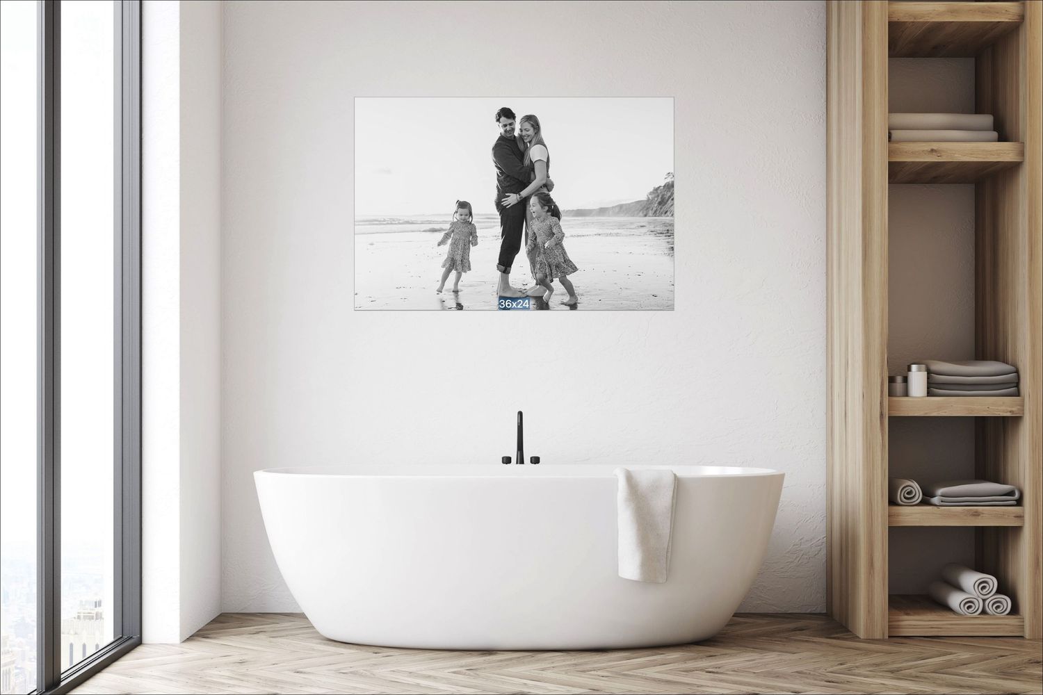 Black and white family photo canvas print displayed on a white bathroom wall above a freestanding bathtub.