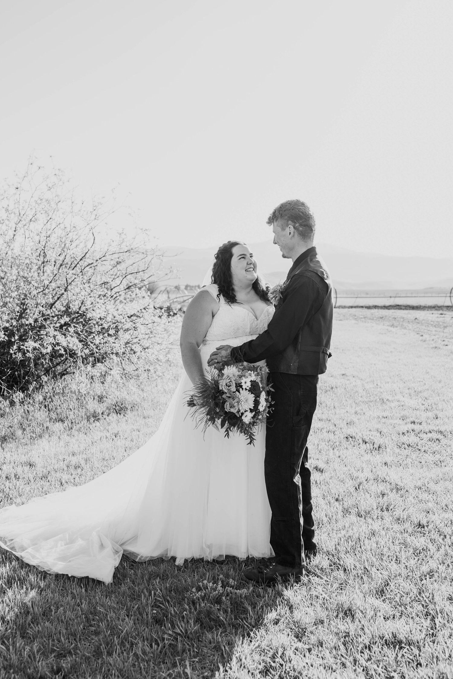 Newlyweds sharing a moment during outdoor wedding portraits.