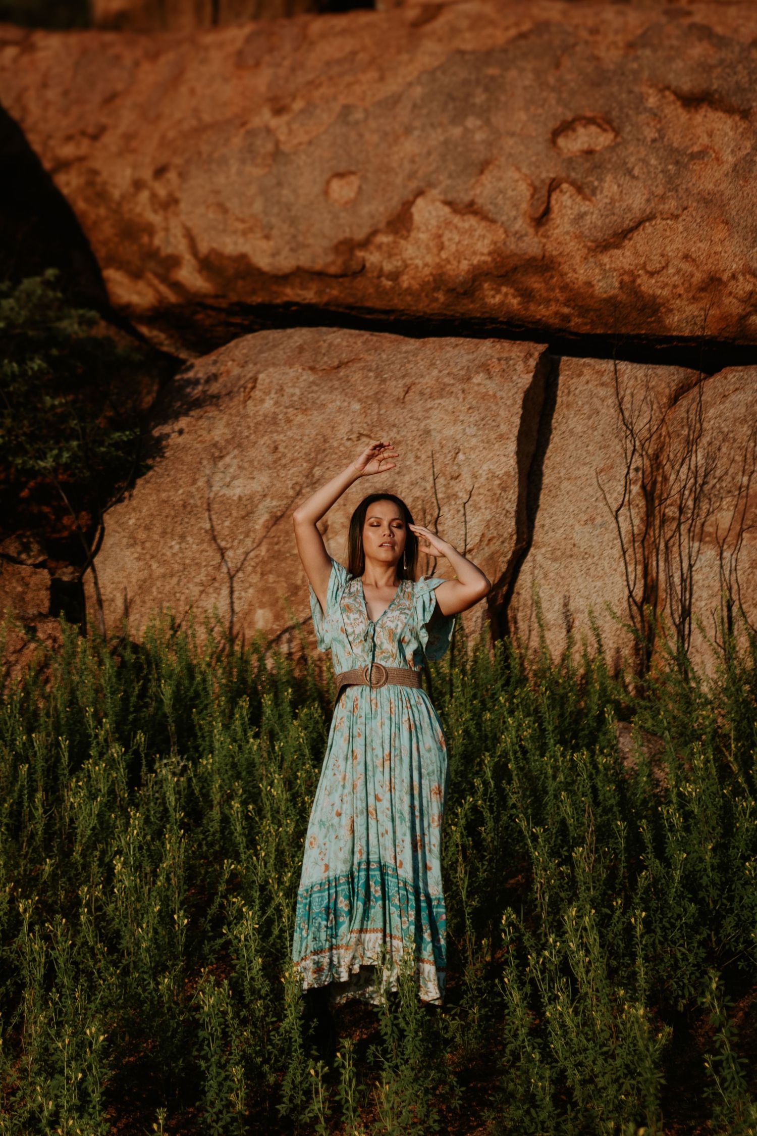 Christina standing in front of the red rocks at the Granite Mines in Mount Isa