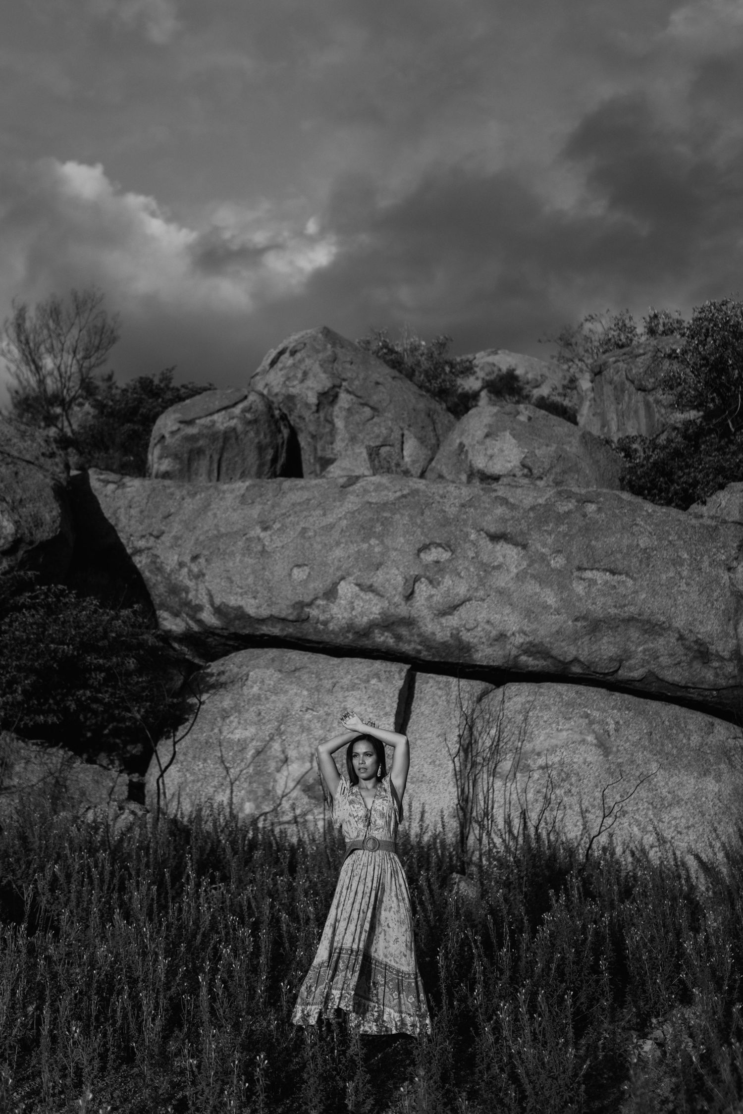 Christina standing in front of the red rocks at the Granite Mines in Mount Isa