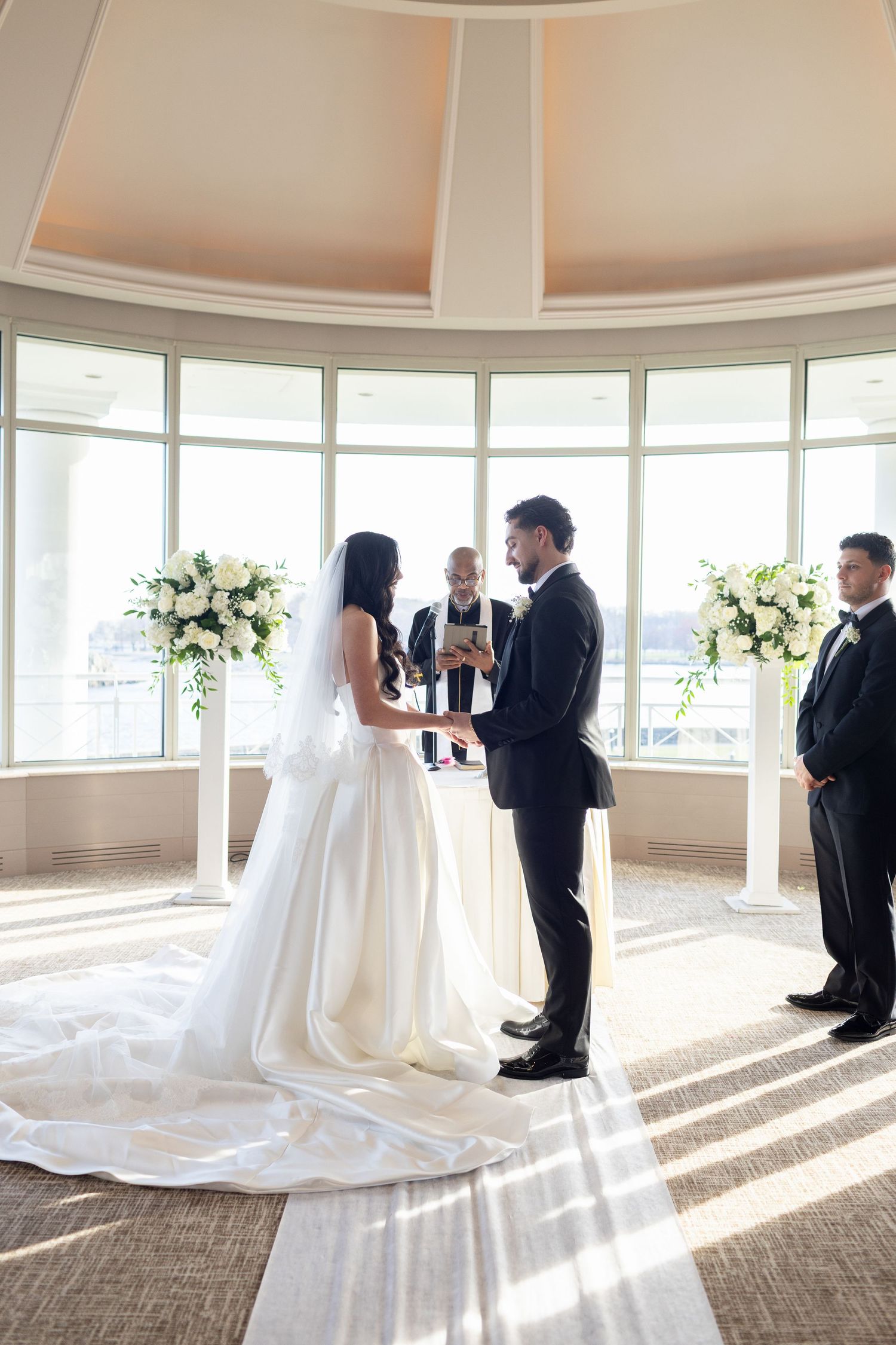 Bride reading her wedding vows to the groom during an intimate waterfront ceremony in glen island Westchester, New York.