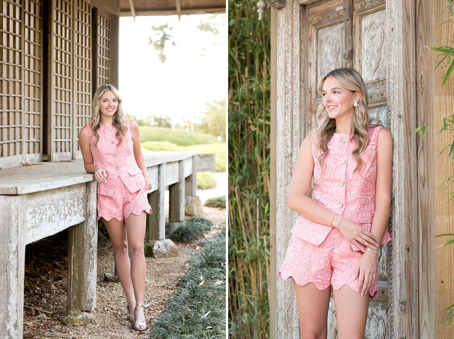 Young woman in pink lace romper posing outdoors near rustic wooden structure and bamboo for senior portraits.