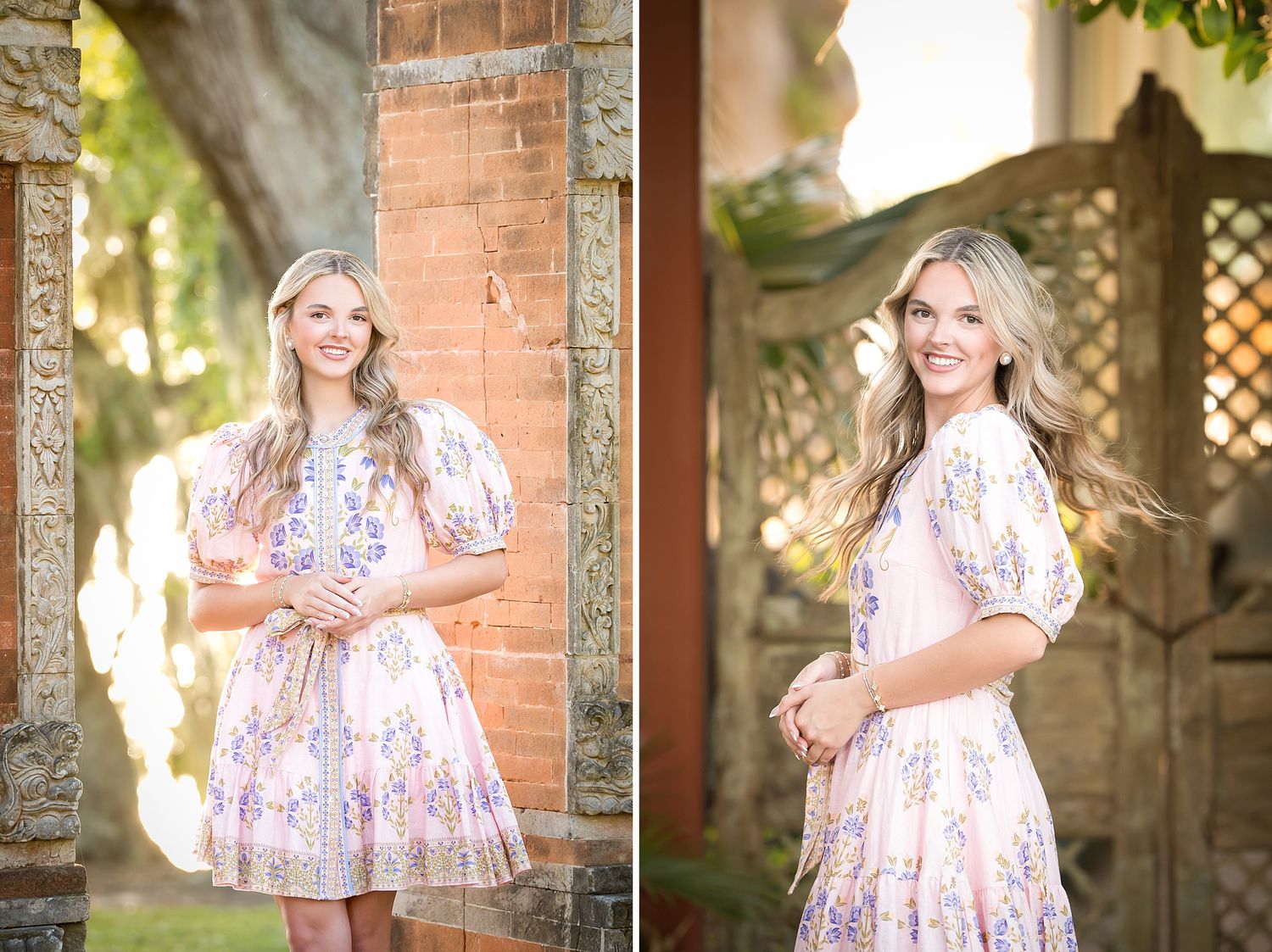 Young blonde woman in floral pink dress poses outdoors near ornate brick columns for senior portrait photos.