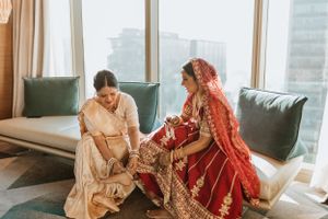 Elegant indoor wedding photography session with natural window lighting.