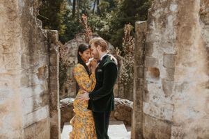Stone archway corridor with natural lighting creating romantic ambiance.