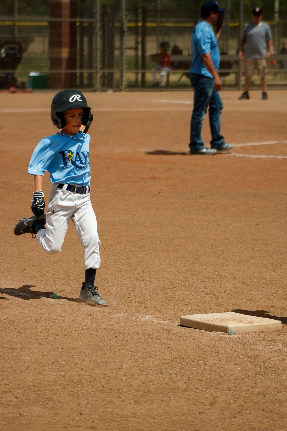 Young boy playing Little League Baseball during a sports photography session in Amarillo, Texas