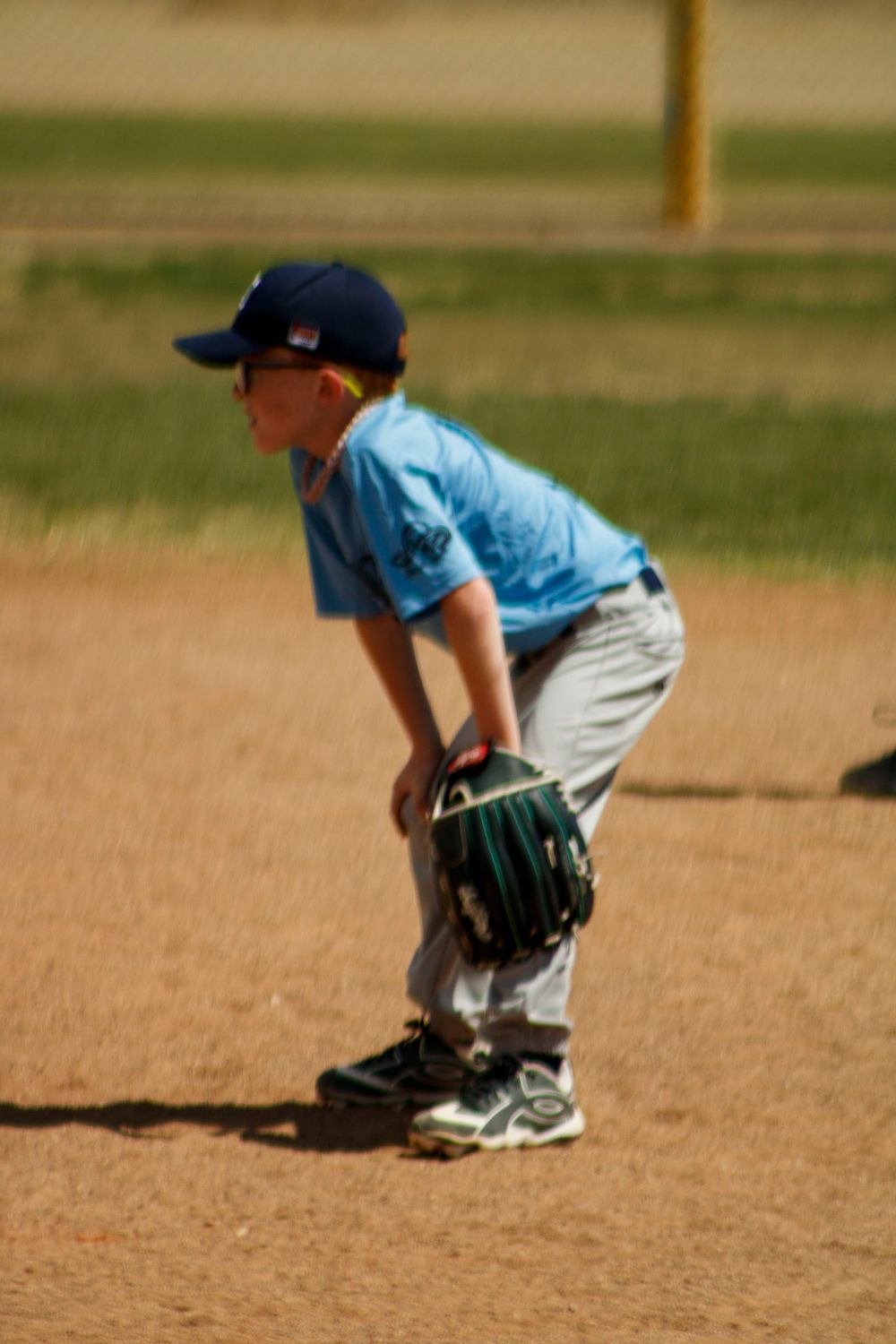 Young boys playing Little League Baseball during a sports photography session in Amarillo, Texas