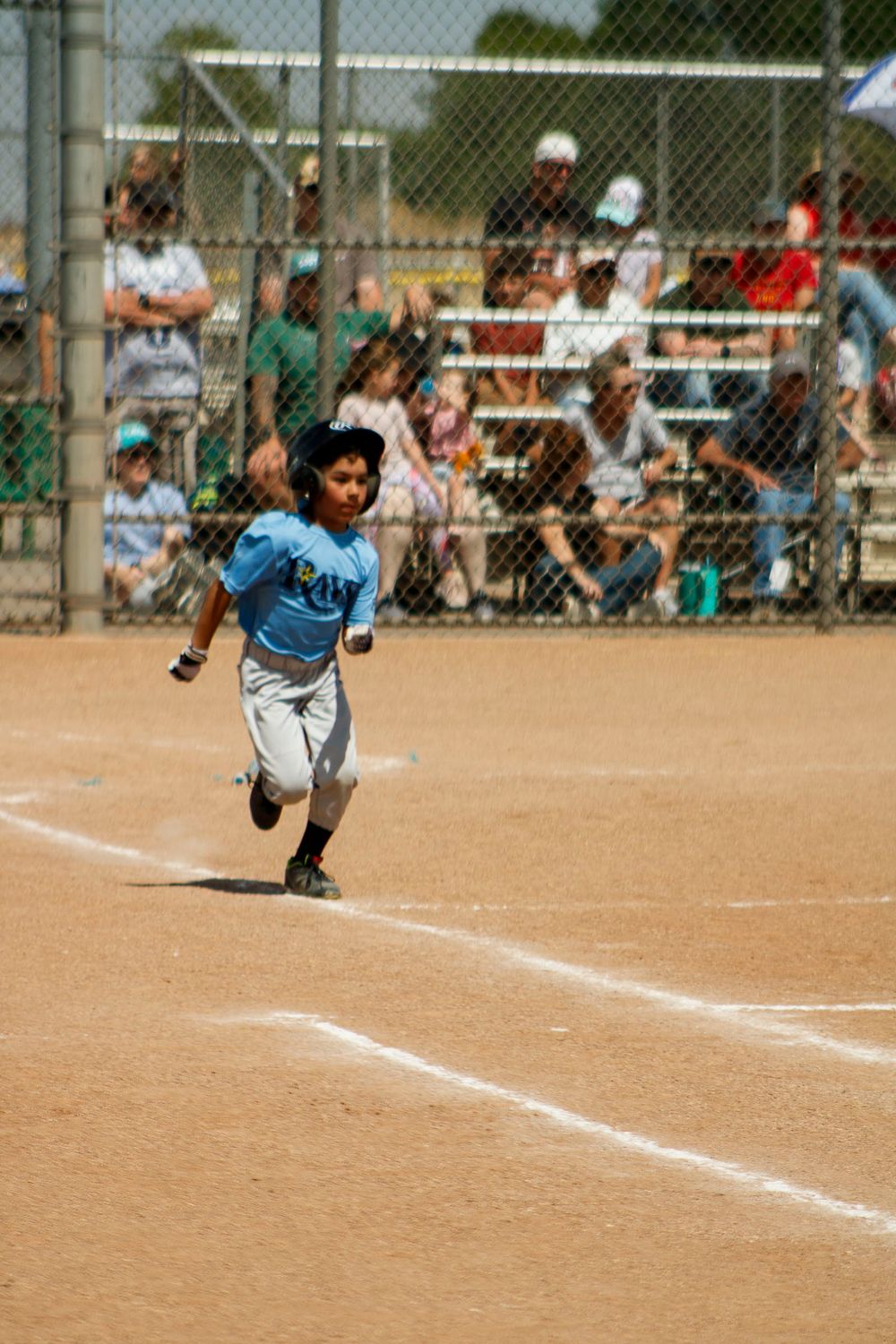 Young boys playing Little League Baseball during a sports photography session in Amarillo, Texas