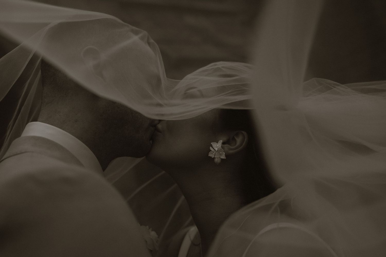 Romantic wedding portrait beneath the veil at Kilronan Castle Estate, Co. Roscommon