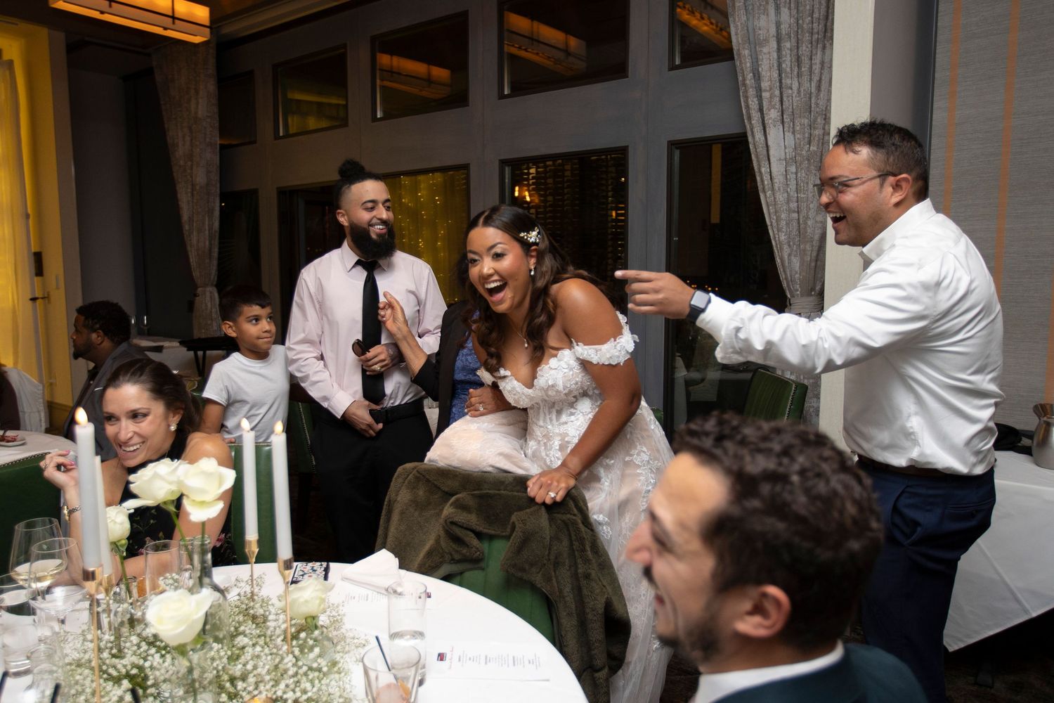 A collage of wedding reception moments showing dancing, toasting and celebration at an elegant indoor venue.