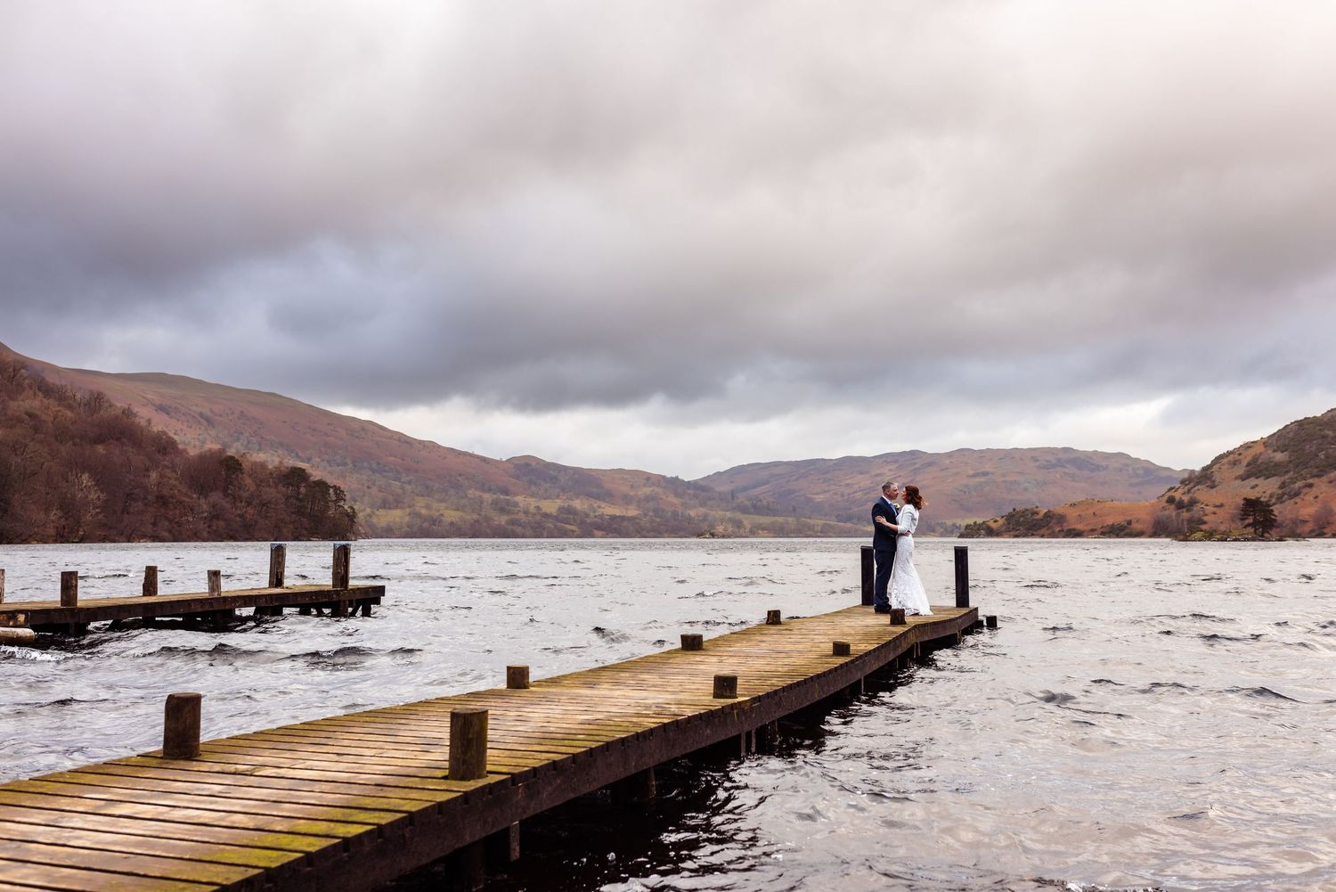 Bride and groom kid son a boat at Gilpin Lake House - Aerial Photo