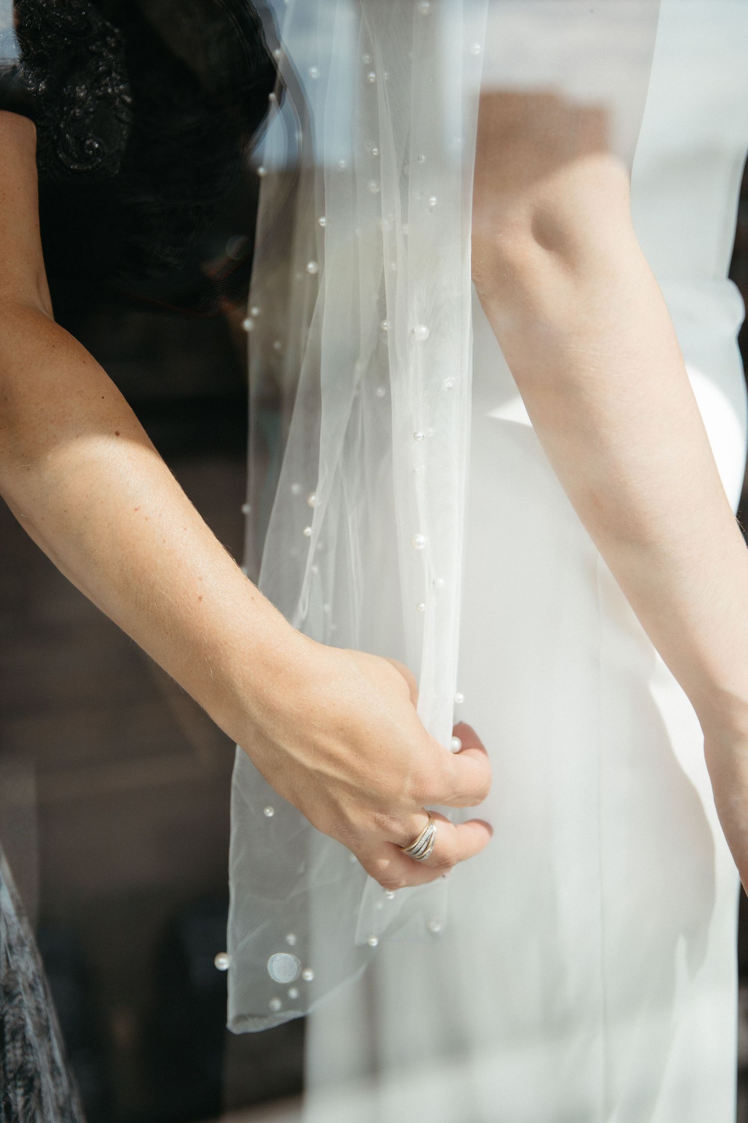mother helps bride into wedding dress, glamorous upscale wedding, getting ready at CANVAS hotel in Moncton New Brunswick photographer