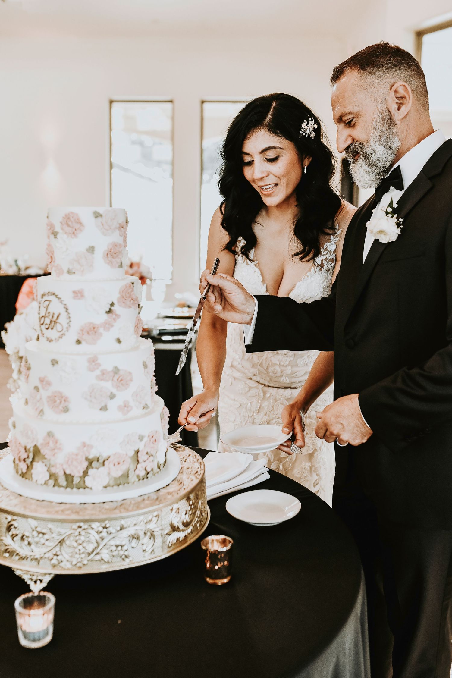 Romantic cake cutting moment during a McKinney vineyard wedding
