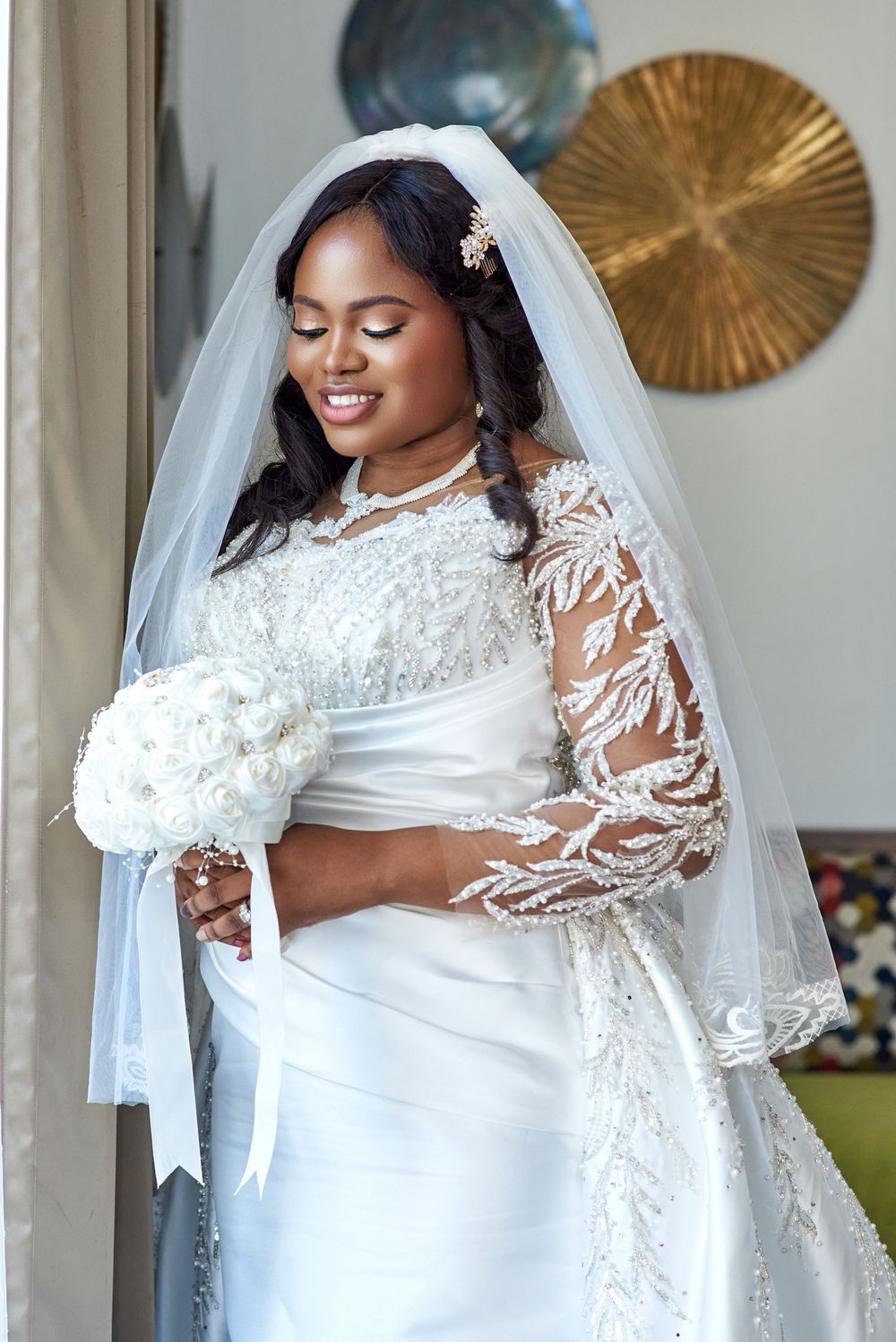 A stunning bridal portrait series showing an elegant white wedding gown with intricate lace sleeves and flowing veil details.