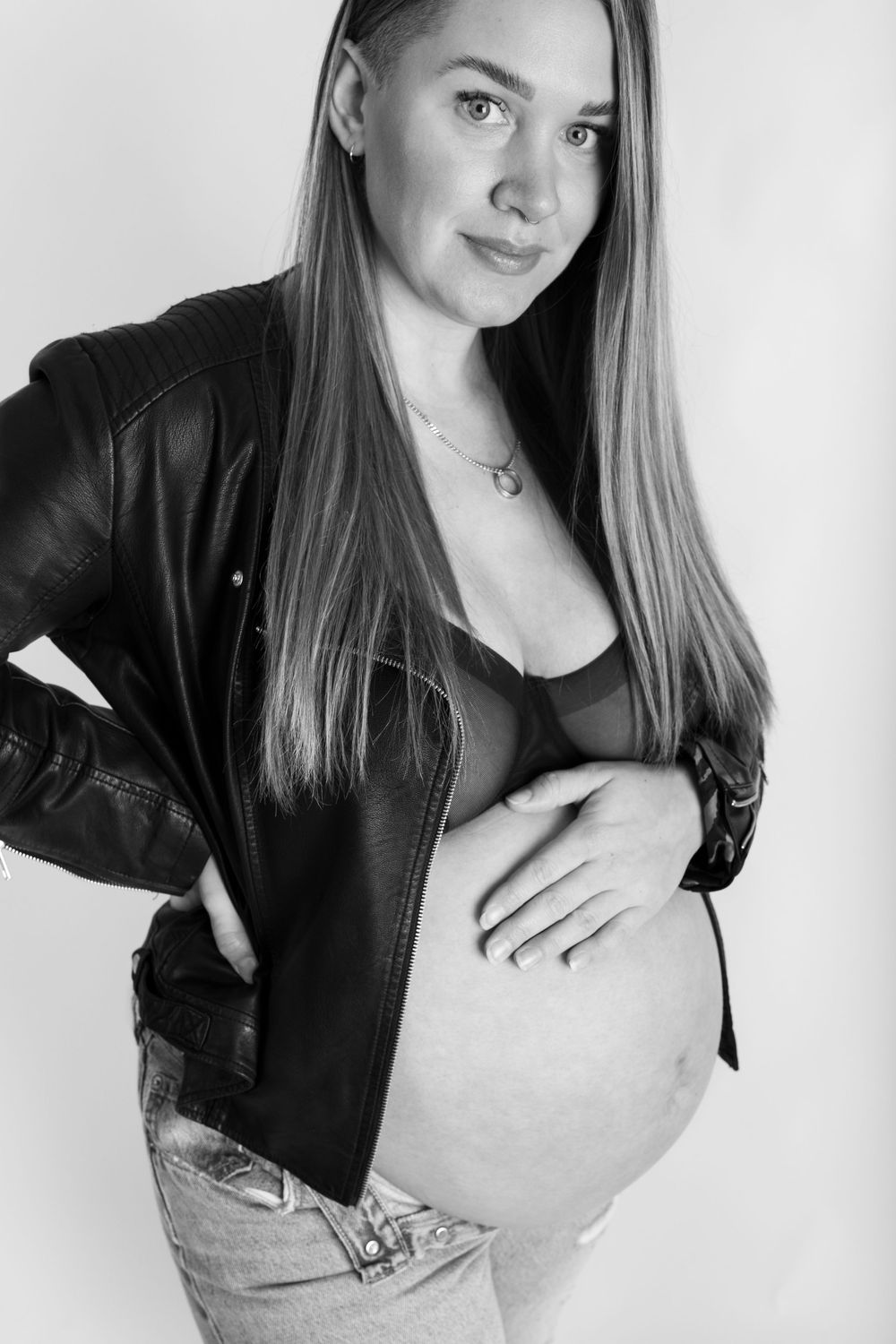 Black and white portrait series showing close-up shots of someone wearing a black jacket in a minimalist style.