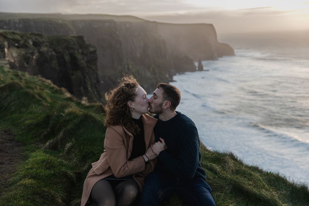 Cinematic storytelling couple session during sunset at Doolin Cliff Walk and Cliffs of Moher in Ireland