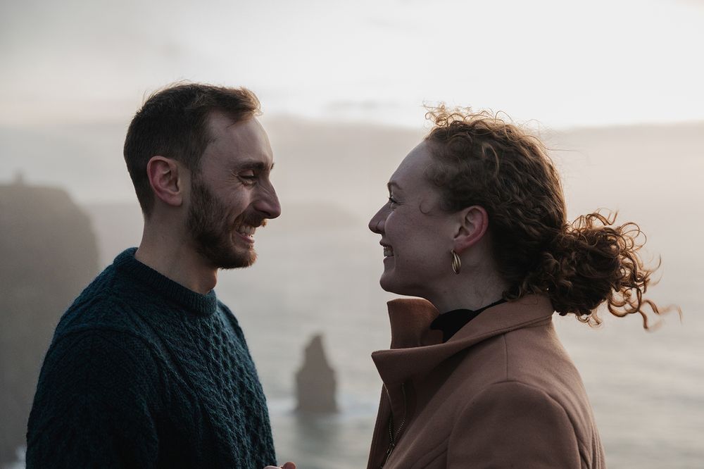 Couple laughing together during Cliffs of Moher cinematic sunset session
