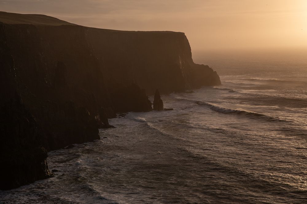 Cinematic storytelling couple session during sunset at Doolin Cliff Walk and Cliffs of Moher in Ireland
