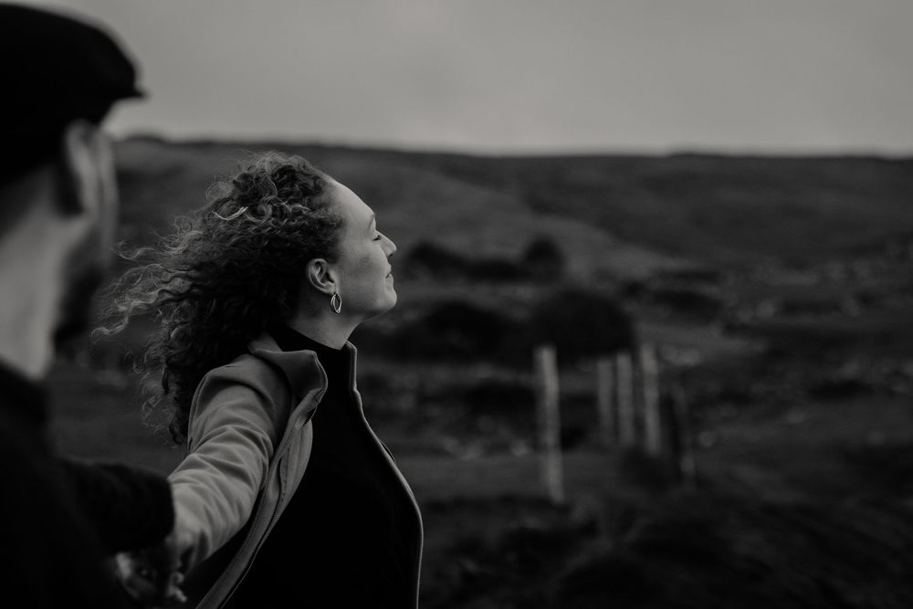 Intimate storytelling portraits capturing quiet connection between couple during Cliffs of Moher adventure session