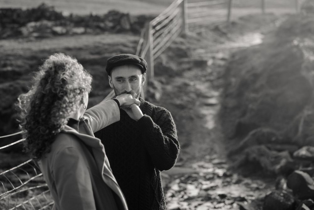 Intimate storytelling portraits capturing quiet connection between couple during Ireland sunset session