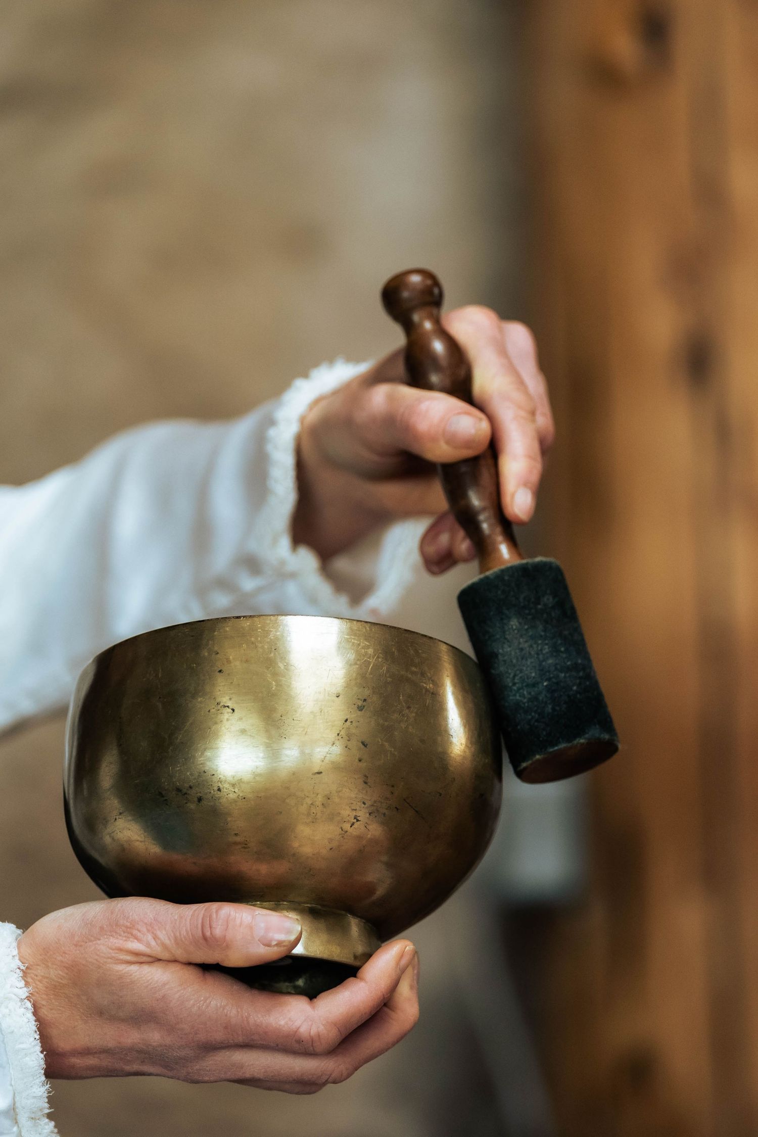 personal branding photograph of a Tibetan singing bowl with a woman holding it