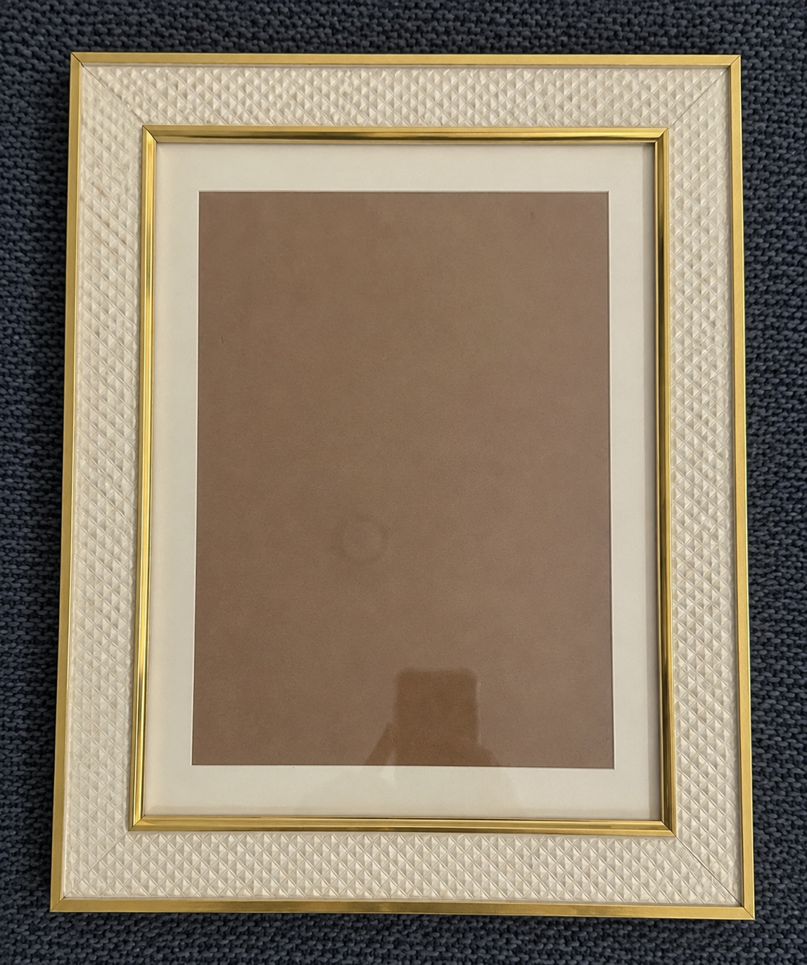 Elegant white woven texture picture frame with gold trim and beige mat, perfect for displaying photos or artwork.