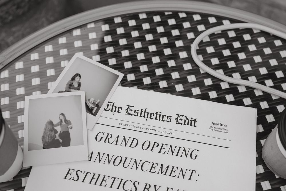 Collection of black and white newspaper clippings and announcements laid out in a row.