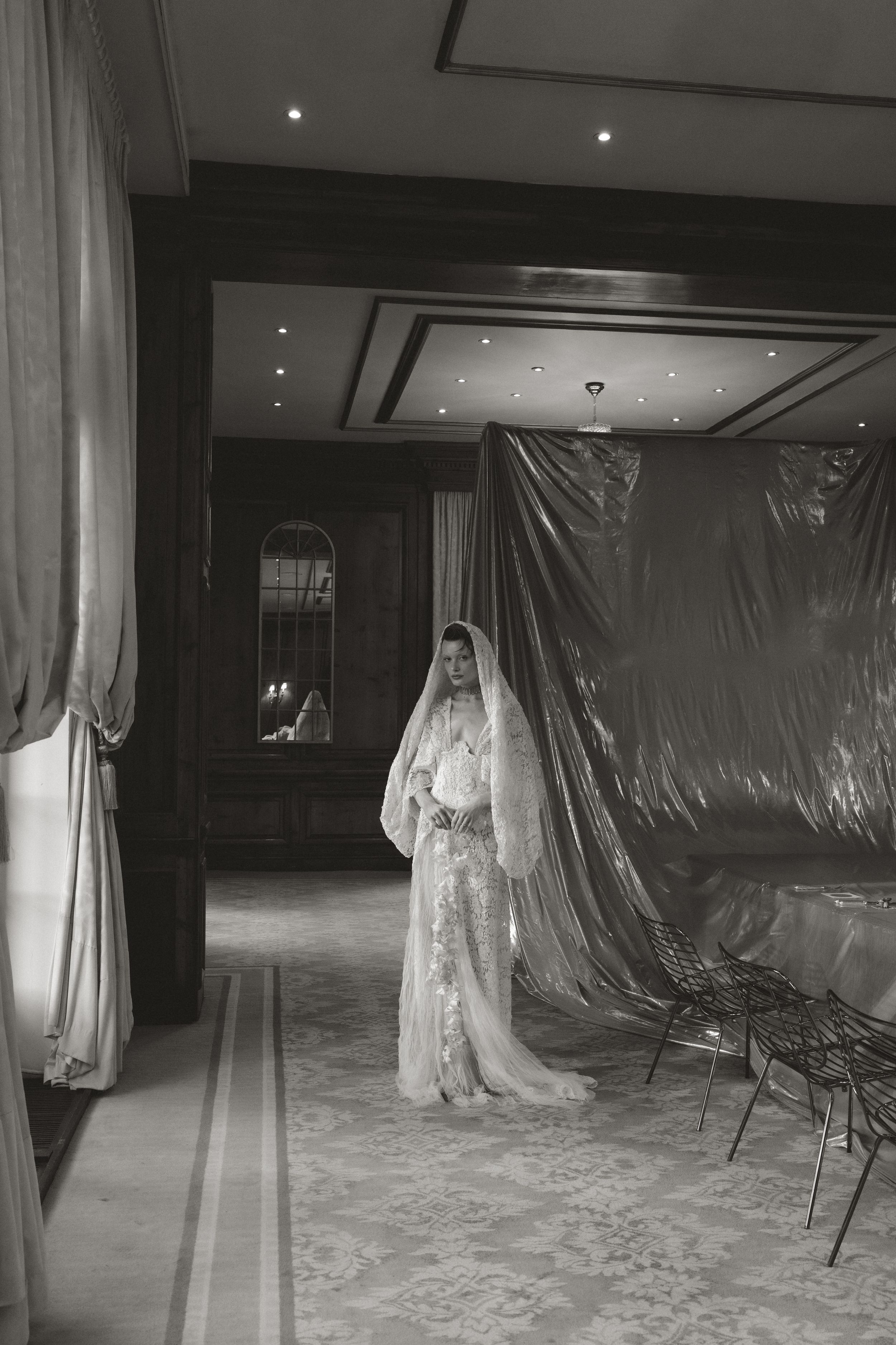 A series of eerie black and white photos showing plastic-covered furniture in a dimly lit room with ghostly silhouettes.