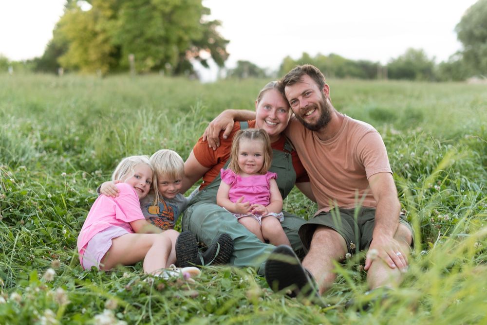 a family at sunset on a ranch in idaho