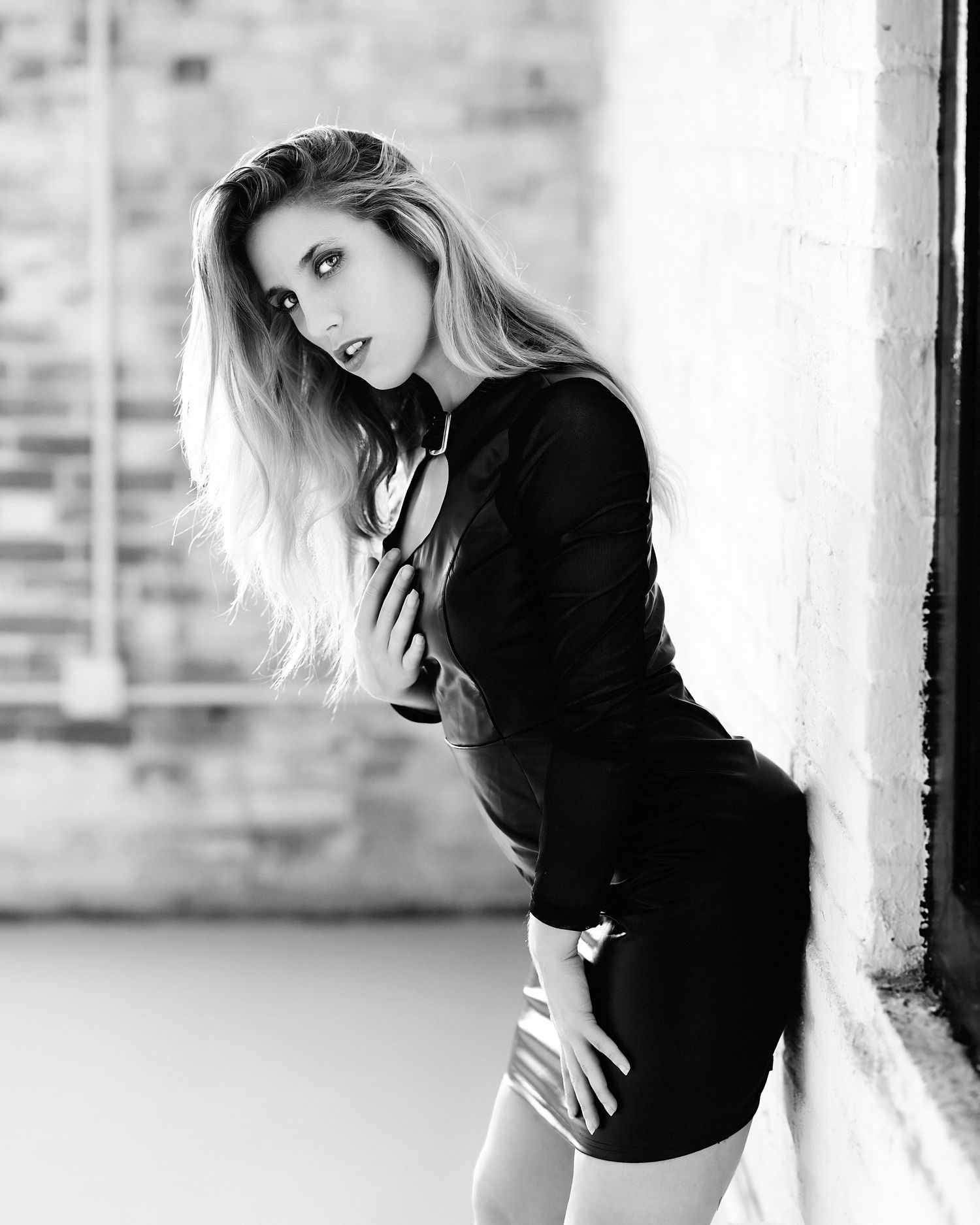 David G Holt Photography - Dramatic black and white fashion portraits of woman in dark clothing by window.