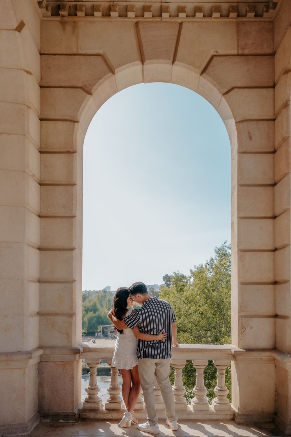 Couple walking through the empty streets of the Gothic Quarter morning.