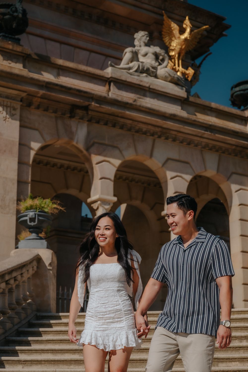 Candid Barcelona photographer capturing joyful laughter between couple.