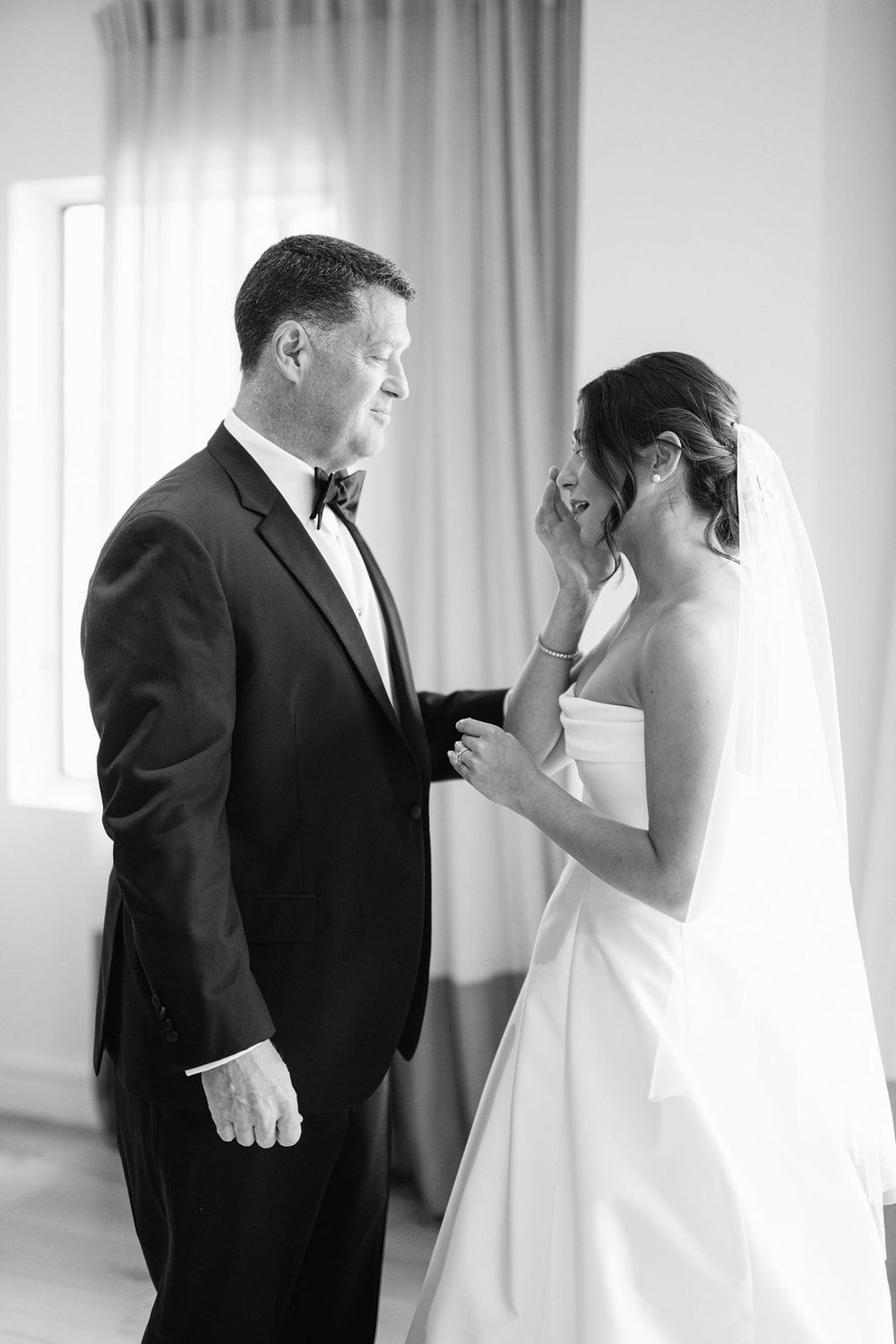 Emotional black and white wedding first look sequence showing tender moments between bride and groom.
