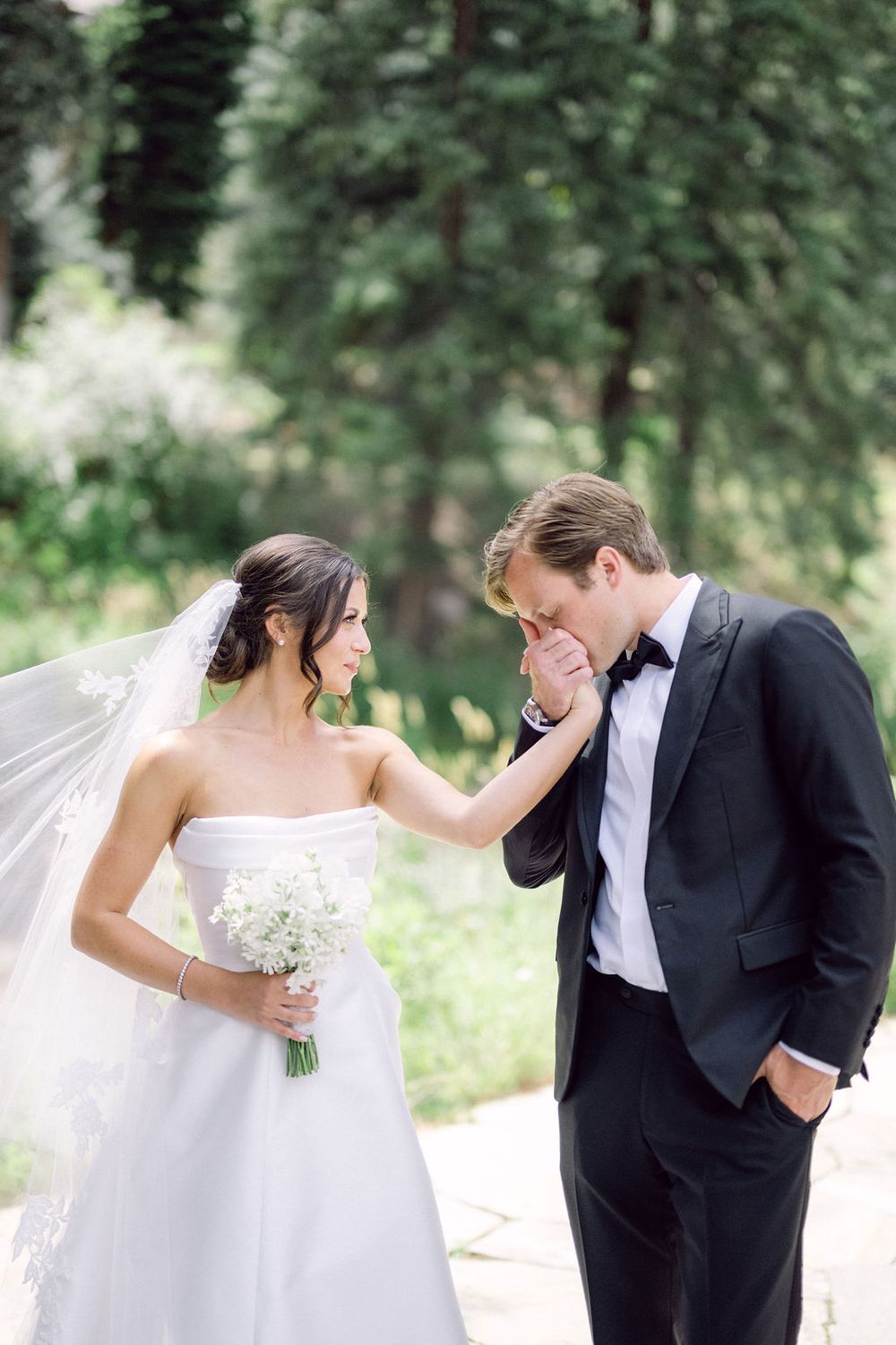 A romantic wedding photo sequence showing playful moments between a bride and groom in an outdoor setting.