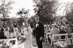 Married couple during their grand exit at a St. Louis wedding.