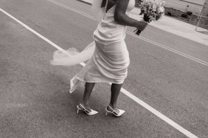 Wedding dress blowing in the wind during a St. Louis wedding.