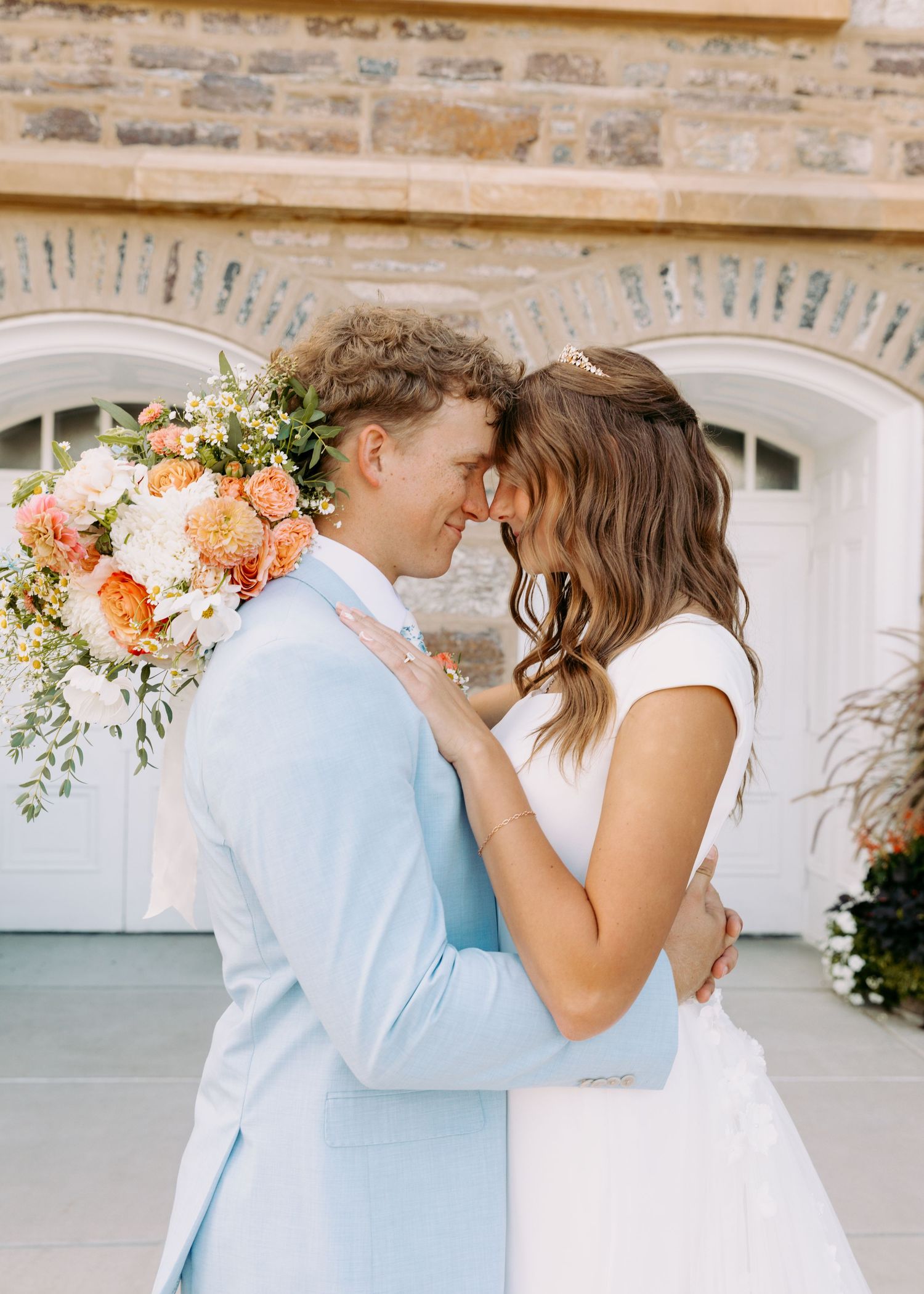 Utah wedding photographer capturing Logan Utah Temple Wedding couple photos