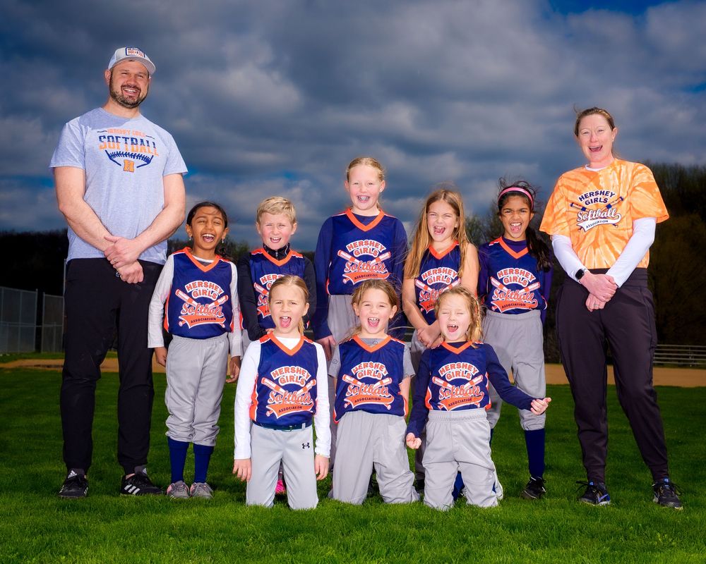 Recreational softball team with dramatic lighting in Hershey PA, photographed by SportsFox Photography.